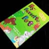 Colorful magic tricks book featuring fun pet characters for children.