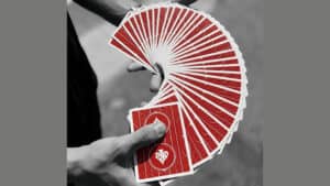 Close-up of Cyril playing cards fanned out in a magician's hand.