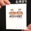Accident magic trick by Liang Kuai & Amor Magic, featuring a card with the word "ACCIDENT" and two i.