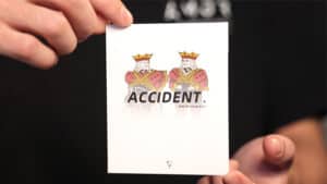 Accident magic trick by Liang Kuai & Amor Magic, featuring a card with the word "ACCIDENT" and two i.