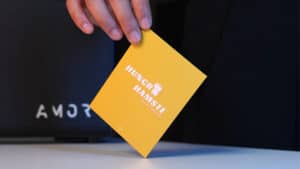 Close-up of a magician holding a yellow 