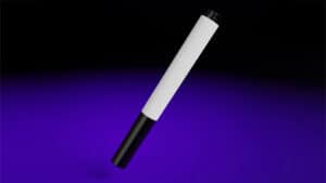 White marker with black tip on a dark purple background, used for magic tricks.