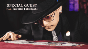 Close-up of a magician performing a card trick with limited edition cards.