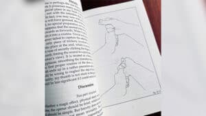 Up of a hand performing a magic trick with a rope and stepladder.