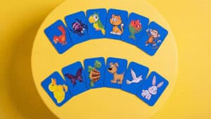 Colorful animal-themed card trick featuring a rooster by Mr. Daba for magical entertainment.