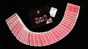 Stunning card magic trick with a fan of red-backed playing cards and a magician's box.