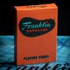 Franklin BBQ orange playing cards, perfect for magic tricks and card enthusiasts.