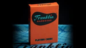 Franklin BBQ orange playing cards, perfect for magic tricks and card enthusiasts.