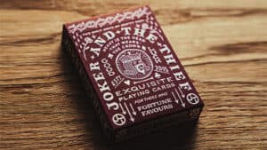 Elegant purple playing card box for magical tricks and card illusions.