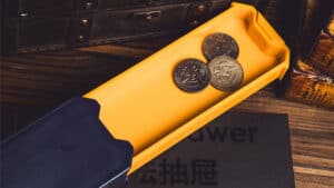 Magic drawer with coins for close-up magic tricks demonstration.