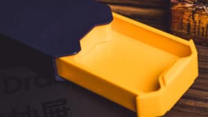 Close-up of the yellow magic drawer used in Bacon Magic's illusion performance.