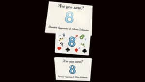 Close-up of a magic card trick with the number 8 and question 