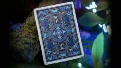 Close-up of Avatar playing cards with intricate blue and black design by theory11.