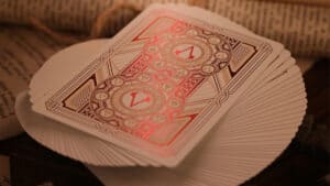 Assassin's Creed Legacy Version 2 Garnet Black Playing Cards with Hidden Blade Design.