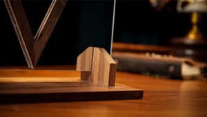 Close-up of a magic trick involving a mirror and wooden props for illusion.