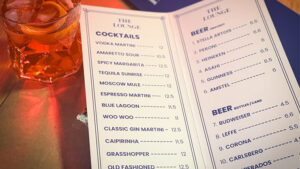 Close-up of a cocktail menu featuring drinks from The Drink Act by Luke Oseland & Cameron Gibson.