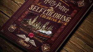 Harry Potter self-coloring book cover with magical illustrations and iconic symbols.