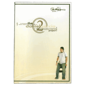 Daniel Garcia performing a magic trick with a card for an audience.