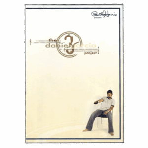 Daniel Garcia performing a magic trick with a bottle in a minimal setting.