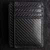 Carbon fiber shadow wallet used for magic tricks and illusions.