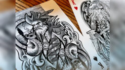 High-quality pirate-themed playing cards featuring intricate artwork and a mechanical box for magic.