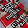 Book cover of "Never Mind the Bollocks" by Etienne Pradier with British flag design.