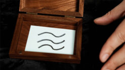 Close-up of Mirage Box with wavy metal pieces inside for magic illusion.