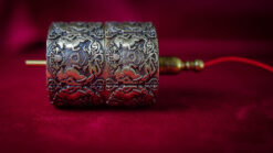 Elegant silver scroll with intricate engravings for magic tricks.