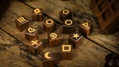 Wooden symbols for magic tricks, including moon, star, heart, and geometric shapes.