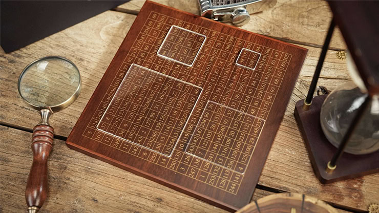 Close-up of a wooden chessboard with engraved squares and numbers, used for magic and destiny calcul.