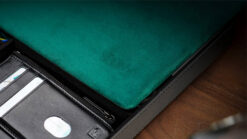Green magicians organizer pad with storage for tricks and accessories.