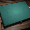 Green magician's organizer pad for magic tricks and performances.