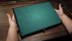 Green magician's organizer pad for magic tricks and performances.