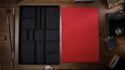 Magicians organizer with red pad for magic tricks and accessories storage.