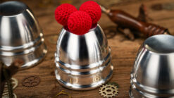 Aluminum alloy cups and balls set for magic tricks, perfect for illusions and performances.