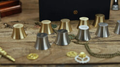Magic weights game with metallic cups and chains for entertaining illusions.