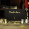 Weights game with cups and coins for magic tricks and illusions.
