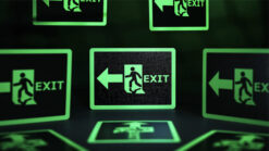 Illuminated exit sign with running figure and arrow, ideal for safety and emergency signage.