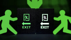Exit sign with running figure and arrow, ideal for emergency escape routes.