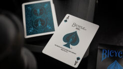 Bicycle blue neon rider ace playing card with intricate spade design.