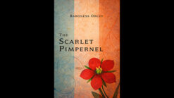 Close-up of a red pimpernel flower with a book-themed background for magic tricks.
