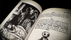 Illusion magic trick from Page Fright, featuring spooky characters and stage performance elements.