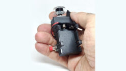 Close-up of a hand holding a magic silk trick device for illusions.