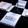 Mirror Paddle illusion with reflective surfaces and cards.