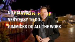 Performer demonstrating Spectra magic trick outdoors at night.