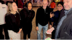 People enjoying magic tricks at Spectra by Luke Dancy event.