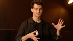 Magician performing No Box magic trick with cards for entertainment.