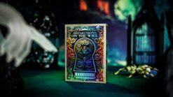 Keyhole reflection of playing cards on the wall for magic tricks.