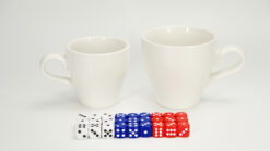 Large white ceramic forcing cups with dice for magic tricks and illusions.
