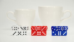 Large cup magic trick with dice for forcing and prediction effects.